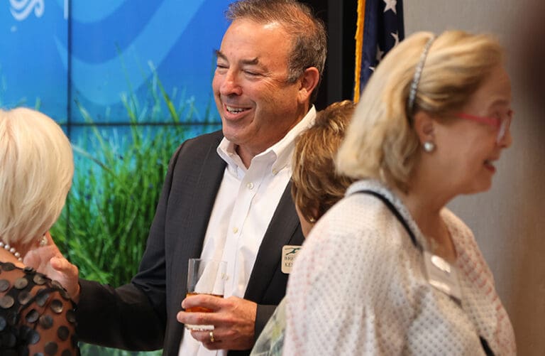 three people enjoying an event